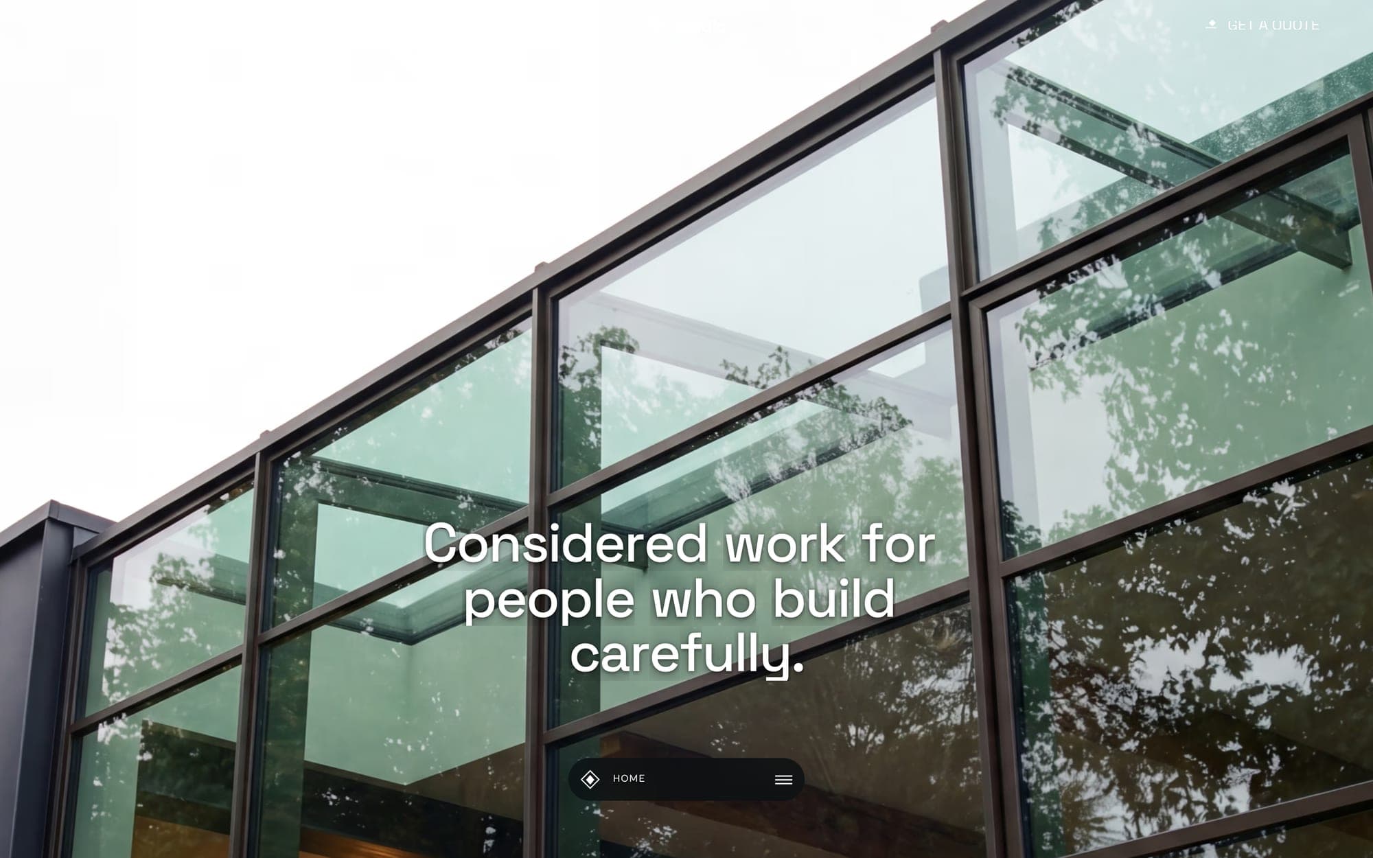 Clarion's hero: a glass-and-steel facade seen from below, with the line Considered work for people who build carefully.