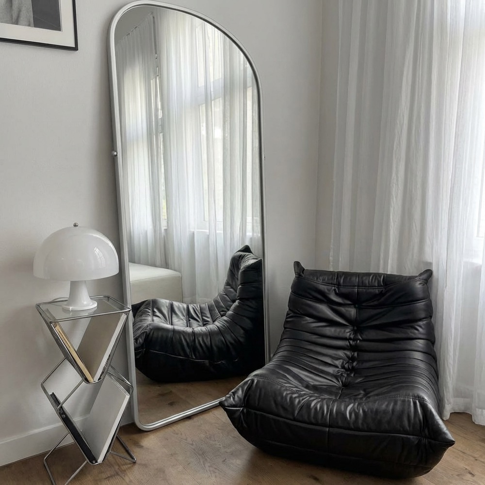Modern living room, leather lounge chairs, sheer curtain daylight