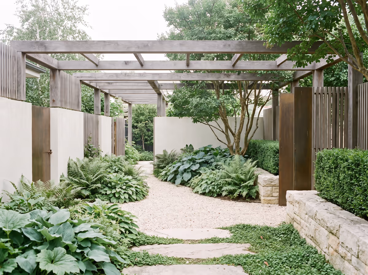 Fernline — A shade garden layered under a hardwood pergola.