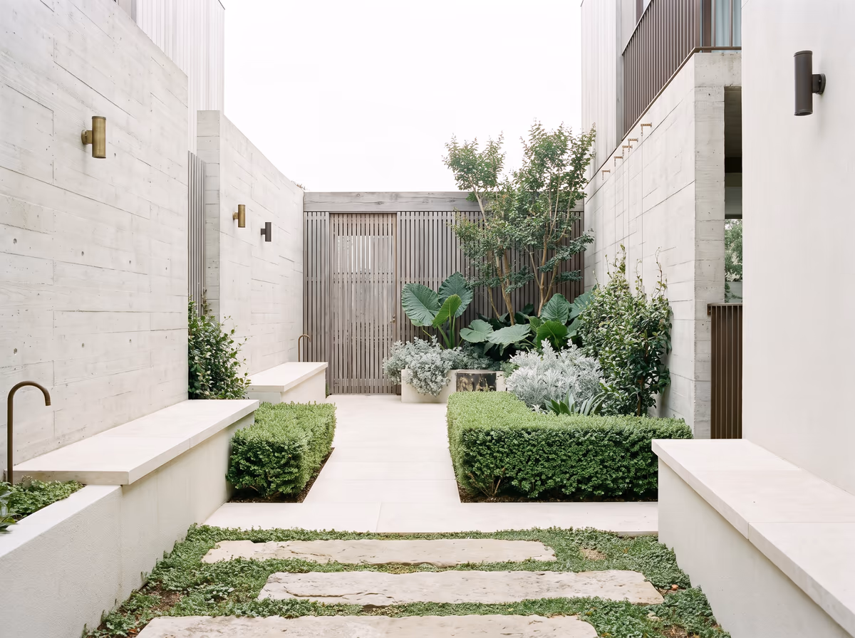 Stonecourt — A narrow side yard rebuilt as a board-formed courtyard garden.