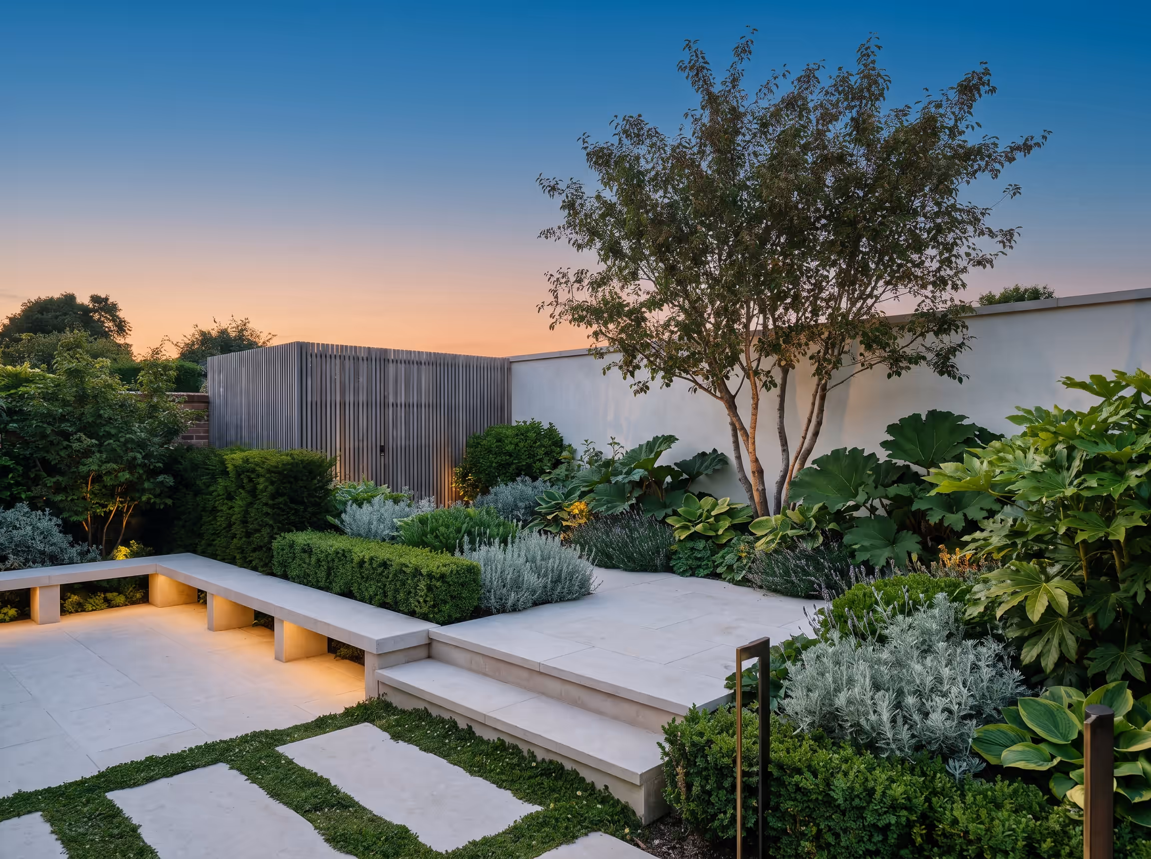 A garden holding the last of the evening light
