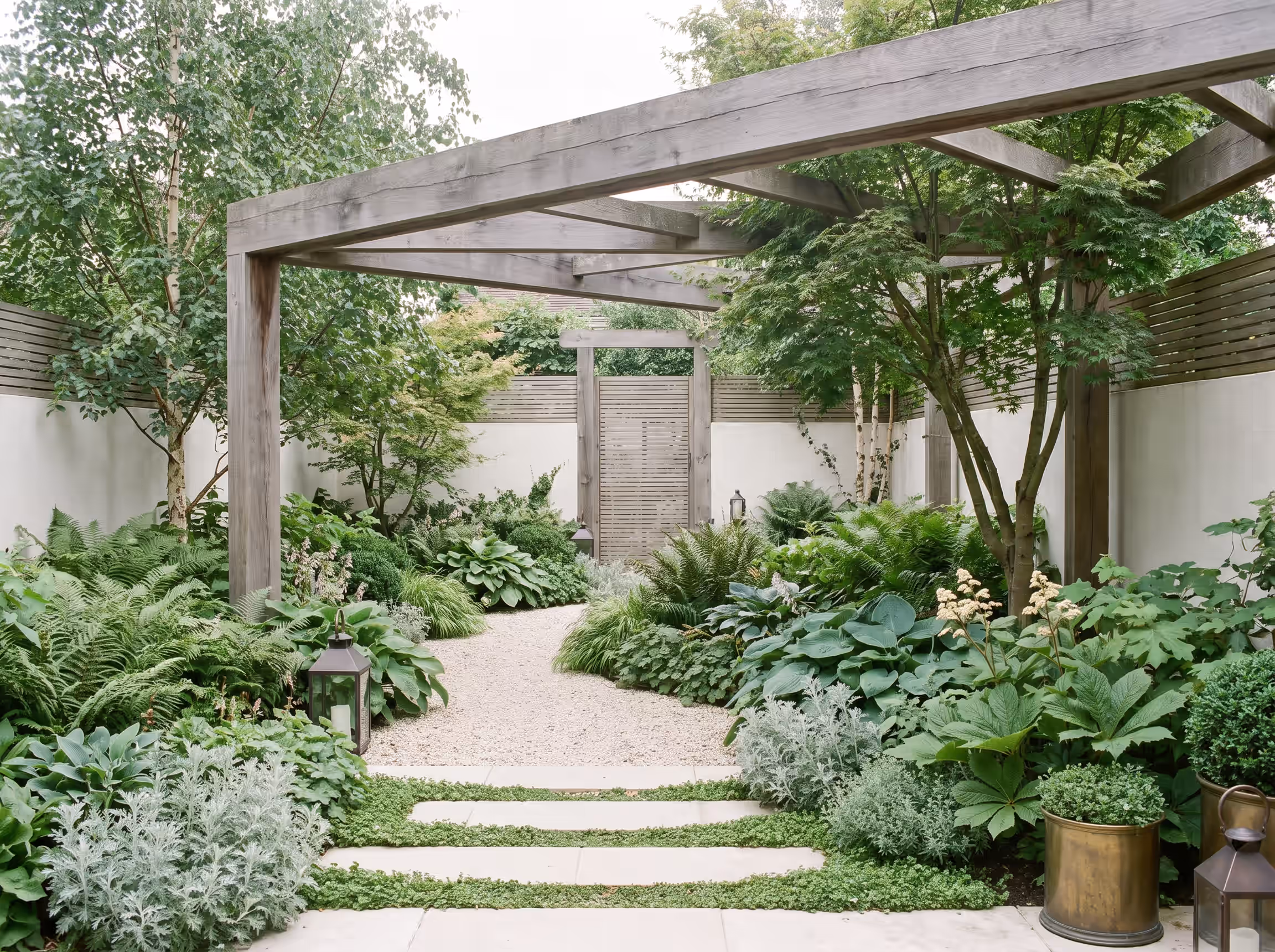 Fernline — A shade garden layered under a hardwood pergola.