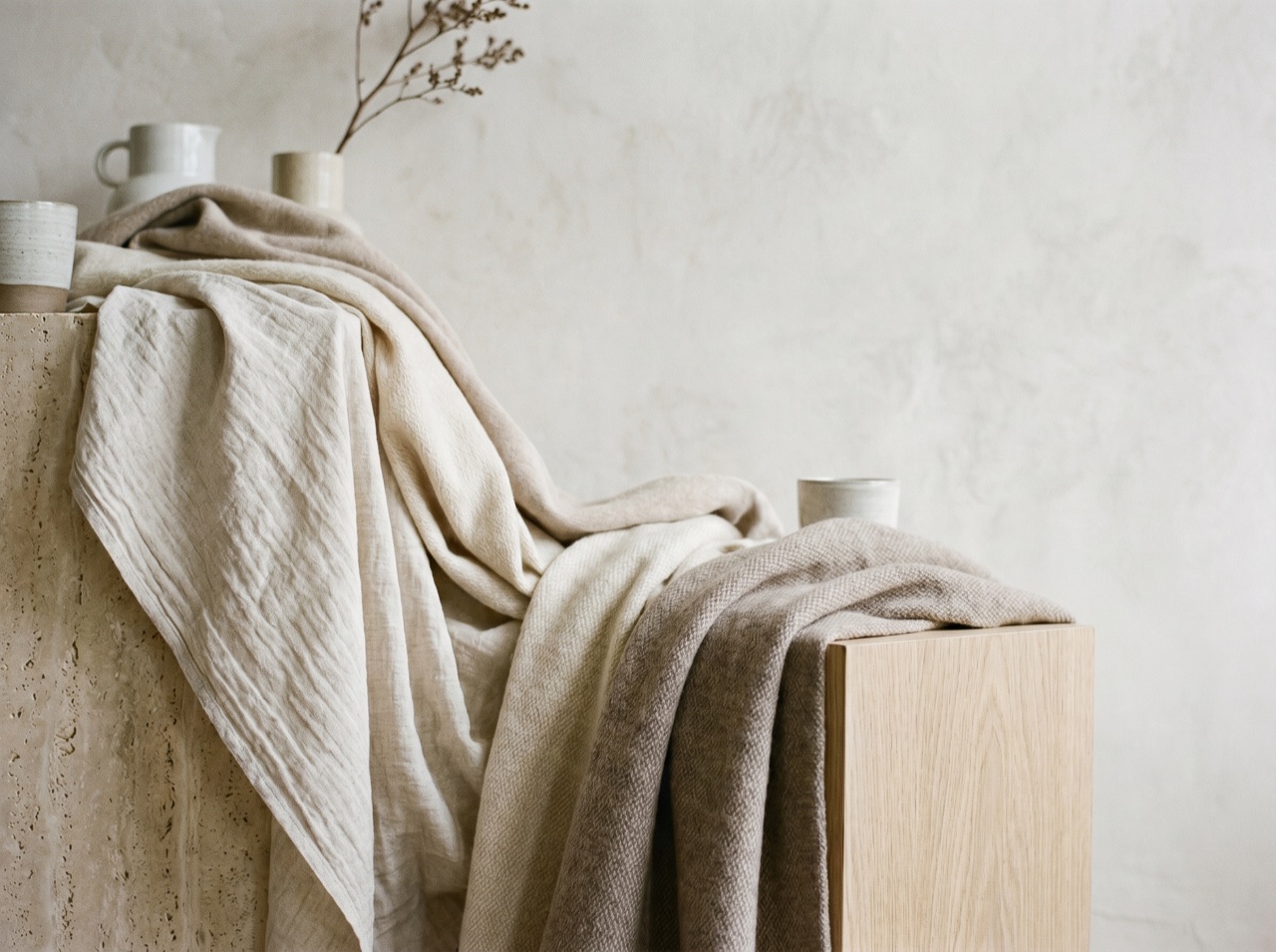 An editorial fashion still of draped fabric in soft natural light