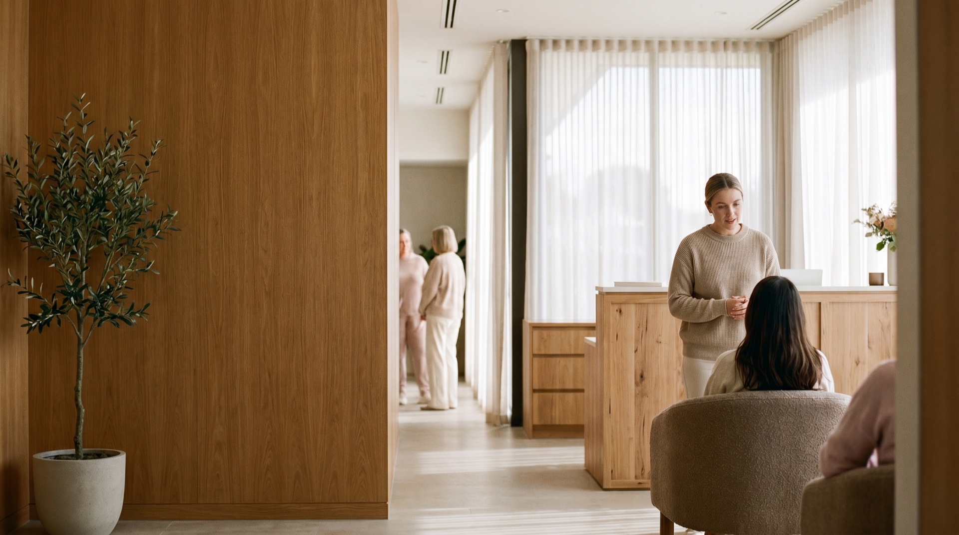 A light-filled, calm modern clinic interior with warm wood and soft daylight, reassuring and uncluttered, generous negative space