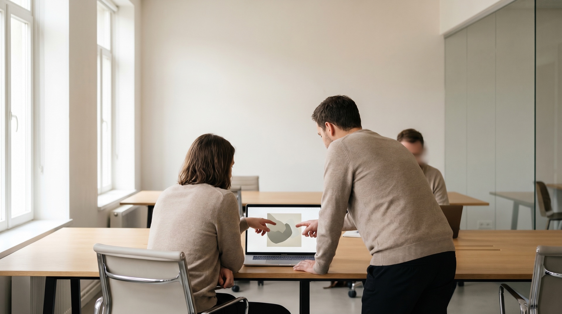 A high-energy startup team at a bright modern workspace on launch day, focused and ambitious, generous negative space